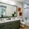 bathroom with a large mirror and ample lighting