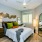 bedroom with a large window and modern decor