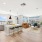 open living concept showing living room and kitchen combined with ample space for seating and modern living room decor