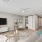 living area that includes kitchen and bright lighting