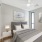 bedroom with modern spaces and a large window